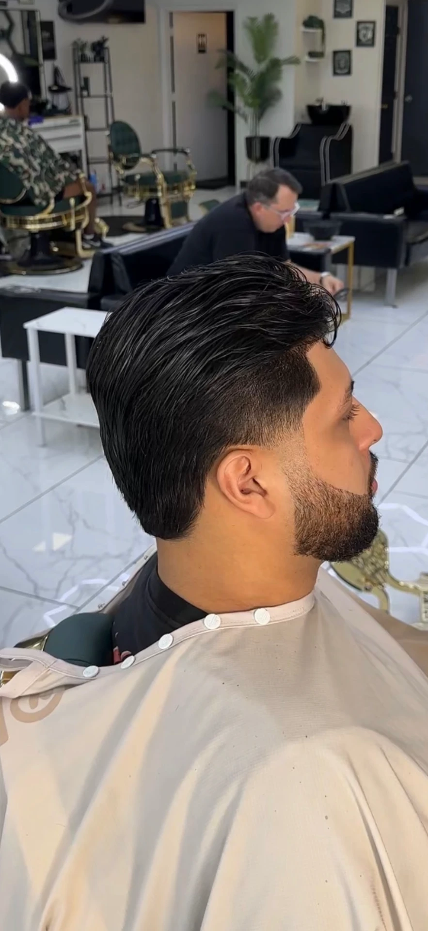 classic fade haircut by Santiago at Elevate Barber Studio in Frisco, Texas